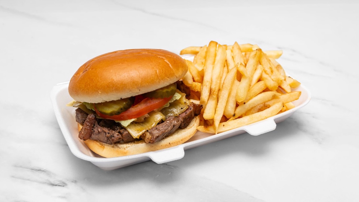 A cheesy beef burger in a brioche bun with a portion of chips from Prime & Crisp